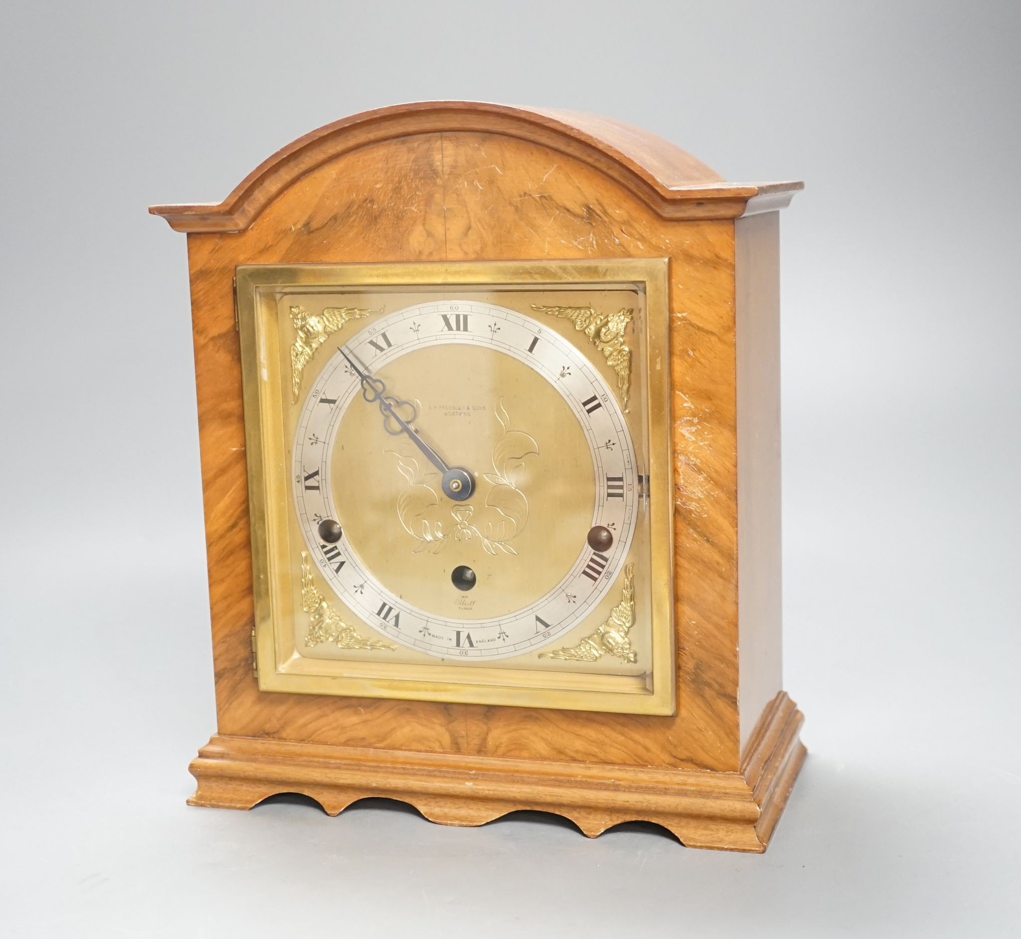 An Elliott walnut cased 8 day chiming mantel clock